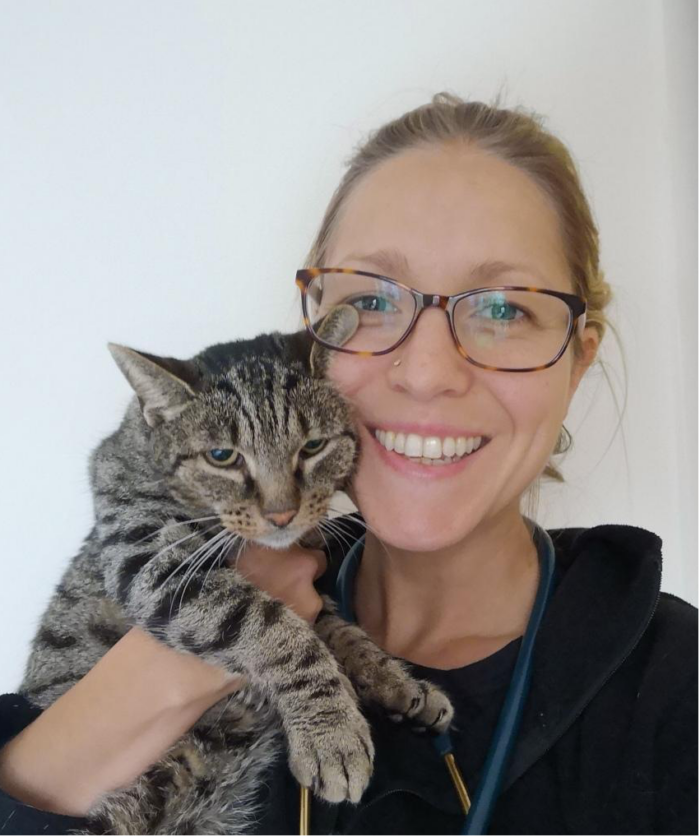 Woman cuddling cat