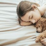 Woman and dog sleeping