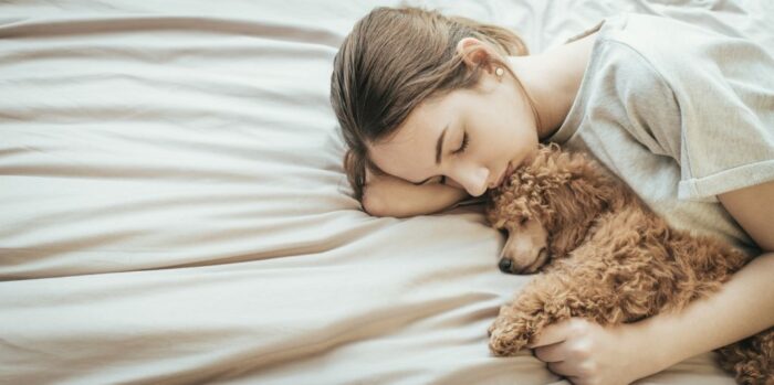 Woman and dog sleeping