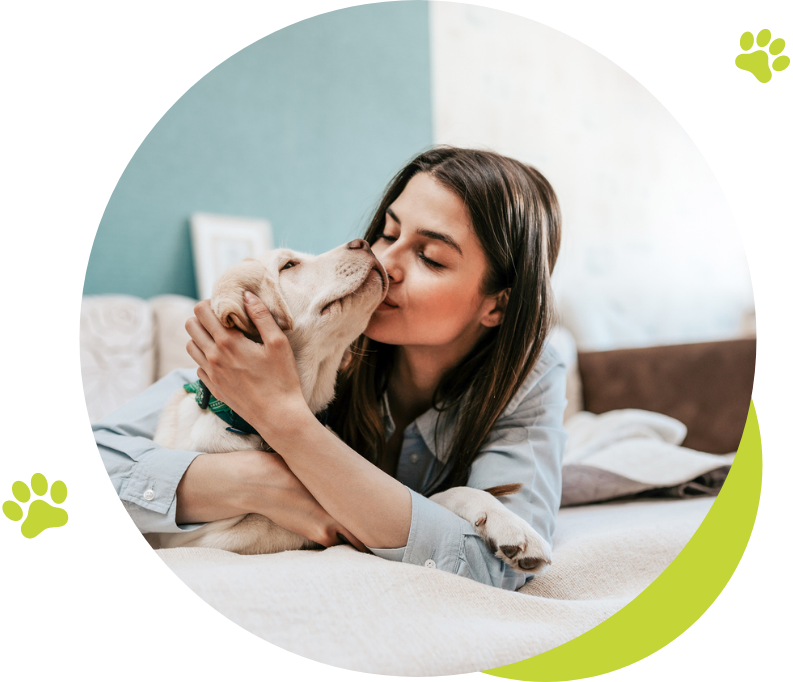 Woman kissing dog